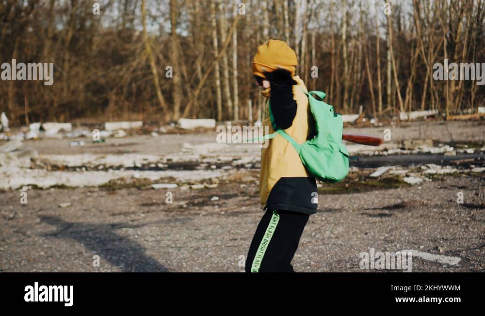 The boy is spinning with a baseball bat in his hands. Childish prank