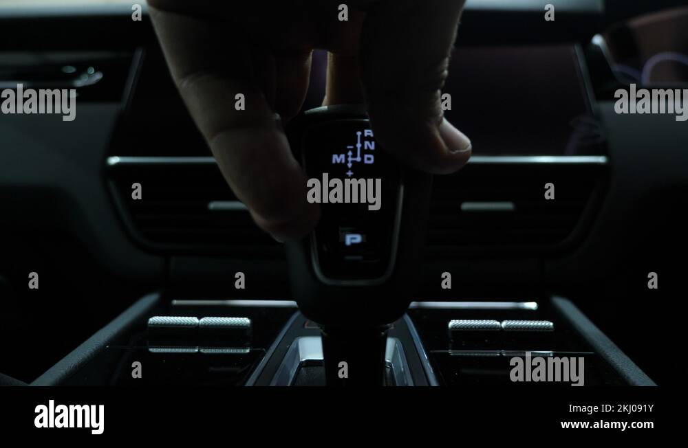 Driver's hand changing gears in a semi automatic car Stock Video