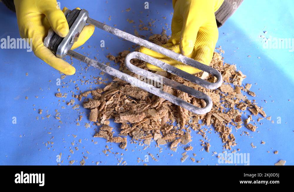 Calcium deposits are hard mineral deposits that latch on to your heating element Stock Video