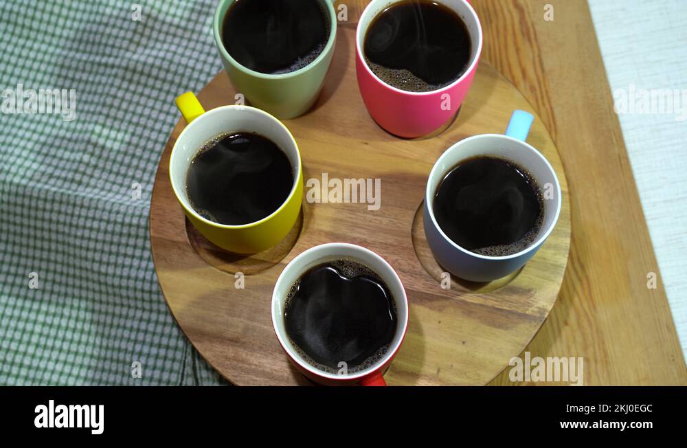 Rotation of the set of hot Black coffee mugs Stock Video Footage - Alamy