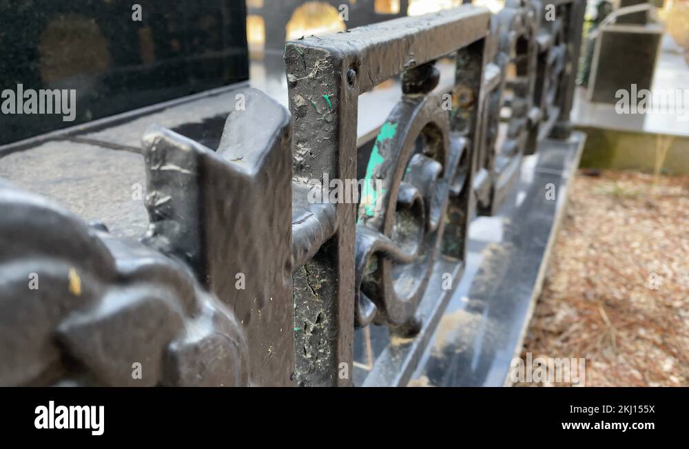 Black marble tombstone granite monument headstone, iron fence around