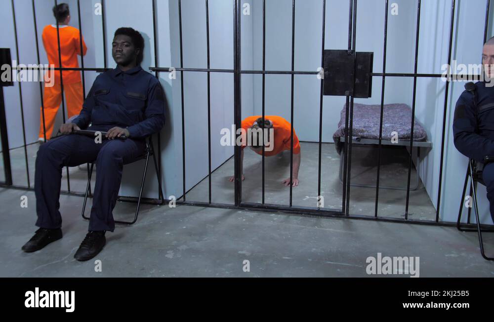 Prison guards look after prisoners in jail Stock Video Footage Alamy