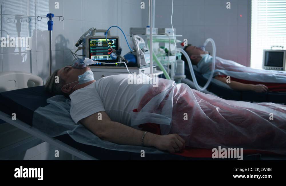 Two patients are connected to a respiratory medical device. Coronavirus