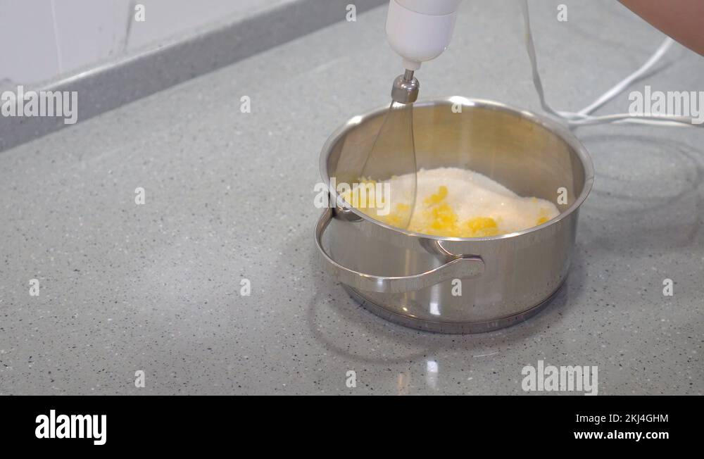 The process of whipping egg yolks with a mixer Stock Video Footage Alamy