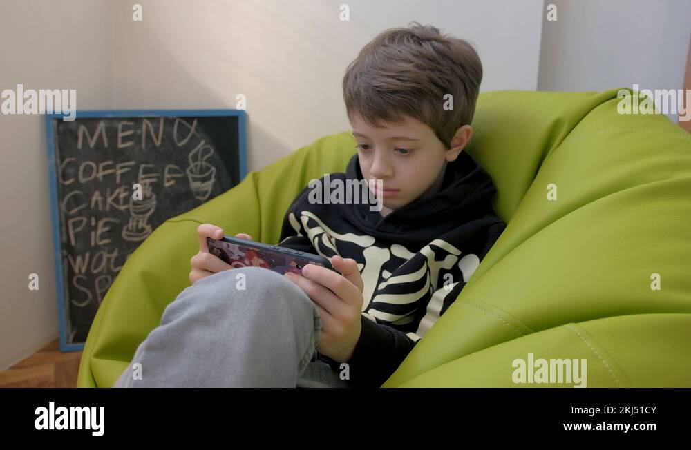 Boy sitting on bean Stock Videos & Footage - HD and 4K Video Clips - Alamy