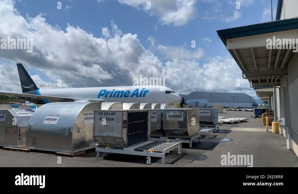 Amazon Prime Air 767 and cargo pallets waiting to be loaded into the