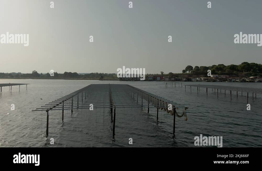 Closeup aerial shooting of oyster farms near Sete city on lake Etang