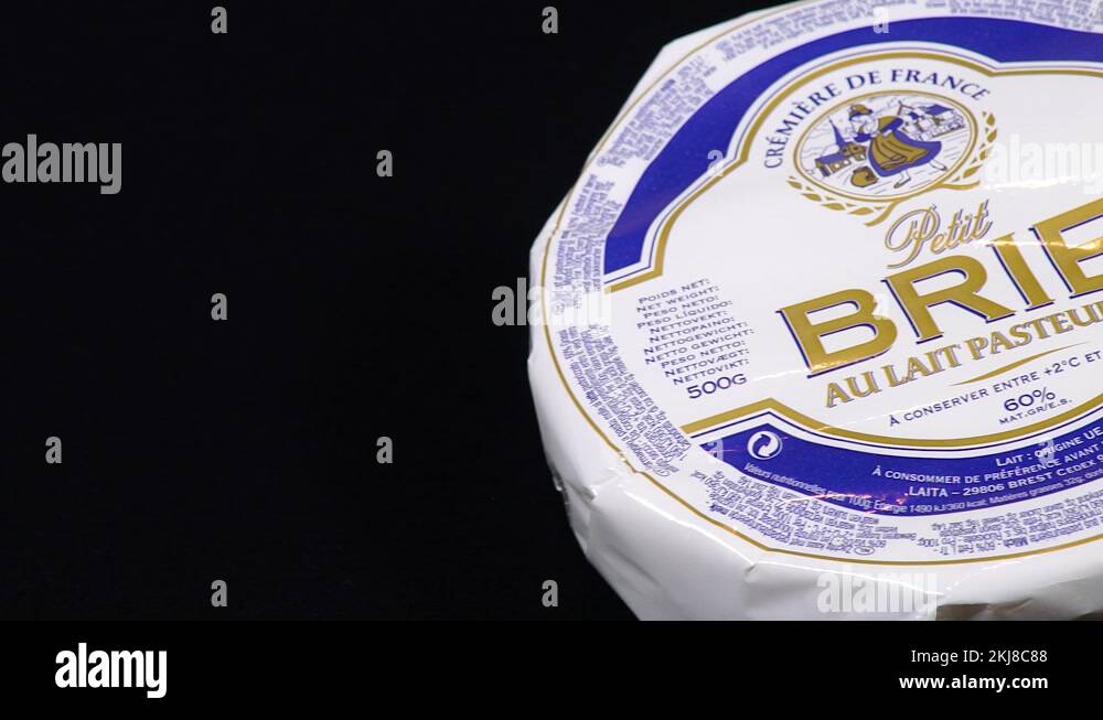 Brie cheese is a famous French cheese. Dolly shooting on a black