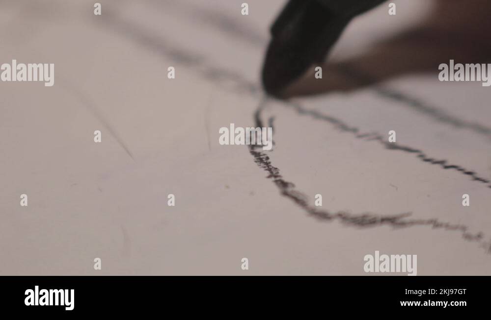 Tracing A Pencil Sketch On White Paper Board Using A Black Marker Stock