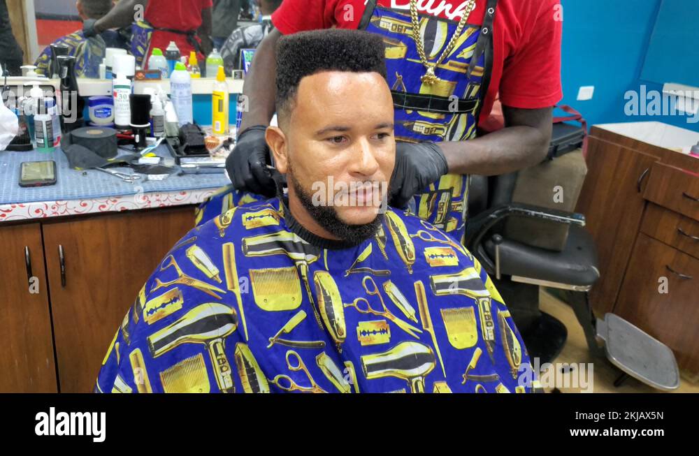 Black African American barber wears protective face mask in covid 4K