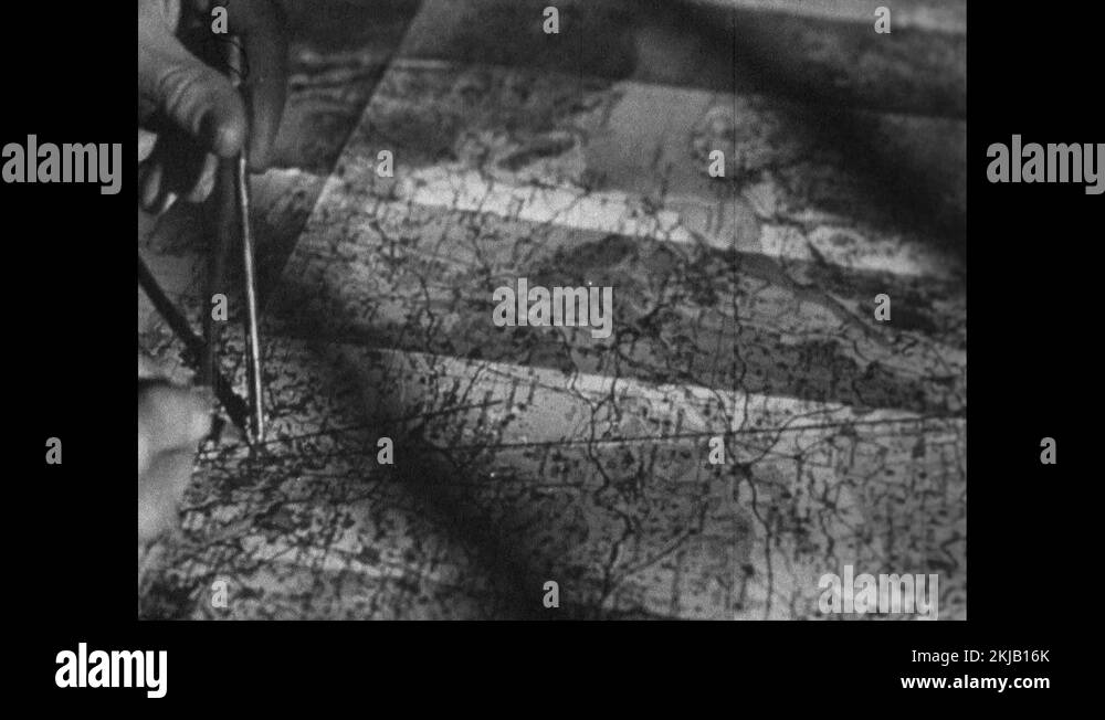 Mans hand using compasses at map, using ruler, drawing tracks for