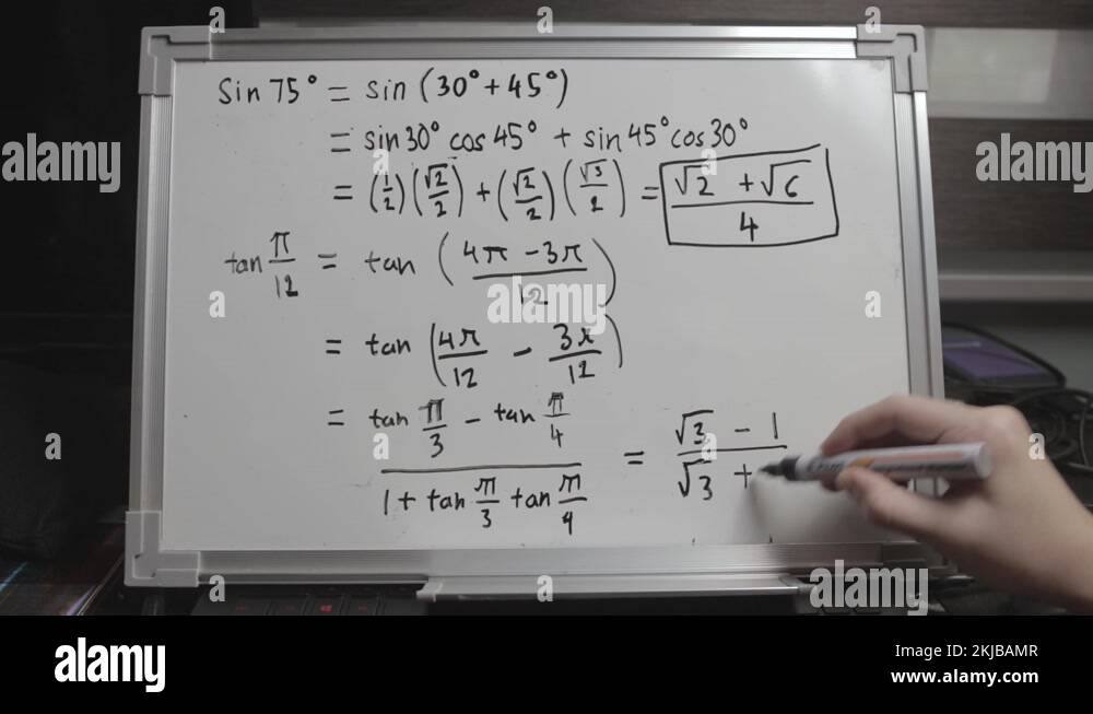 Hand writing solution to a mathematical equation on whiteboard Stock ...