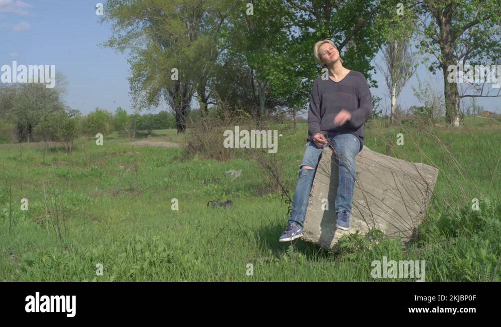 Short haired blonde sitting Stock Videos & Footage HD and 4K Video