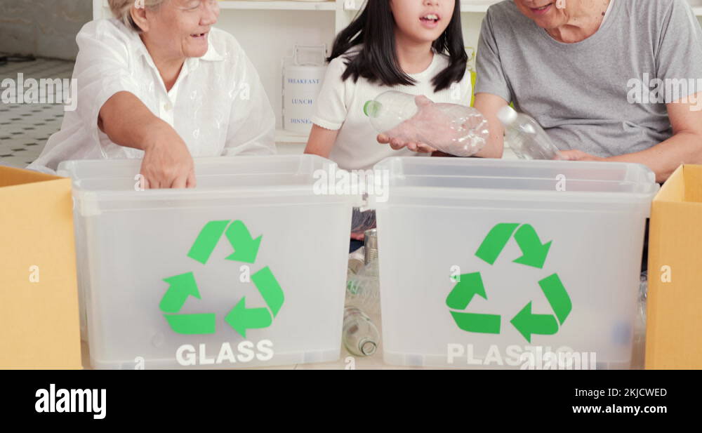 Little girl and her family helping to separate plastic into recyclable