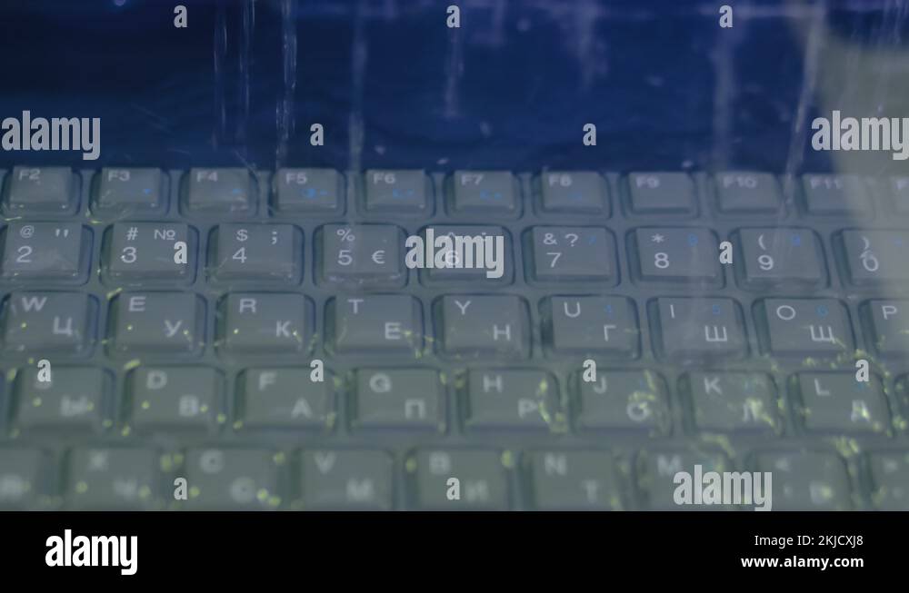 Keyboard of rugged laptop computer during water resistance test close