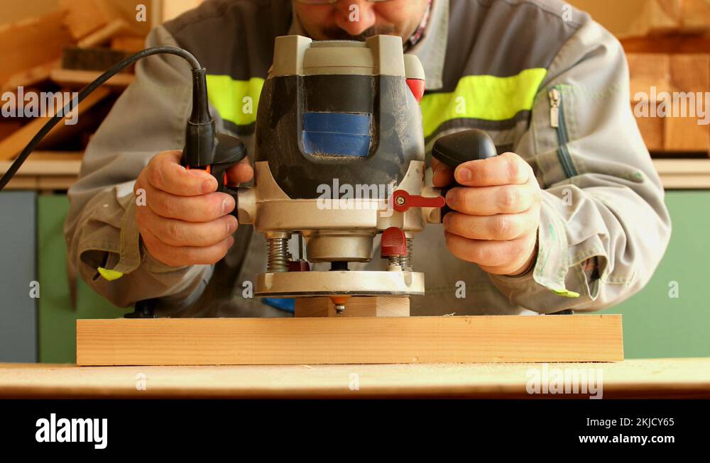 Woodworker work with milling router machine in the carpentry Stock