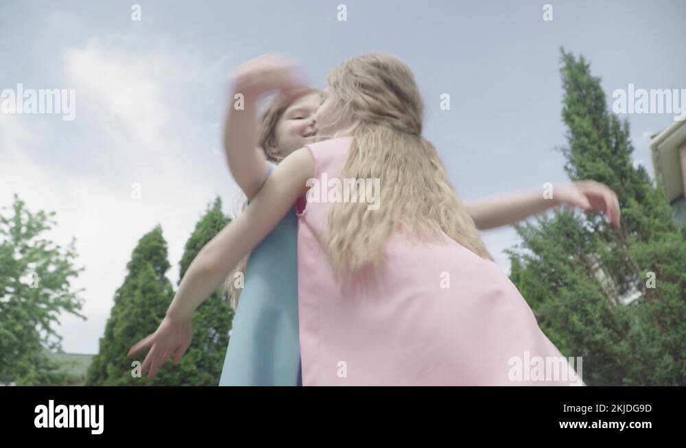 Twins hugging Stock Videos & Footage - HD and 4K Video Clips - Alamy