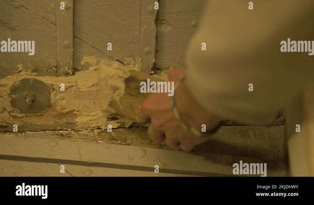 Applying fillers restored wood rot inside wooden boat Stock Video