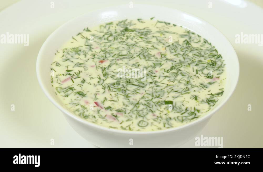 Traditional Russian cold soup called Okroshka Stock Video Footage Alamy