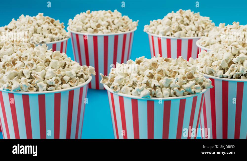 Seamless looping animation of full popcorn buckets. Boxes are spinning