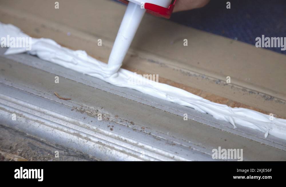 Applying silicone sealant caulking gun Stock Videos & Footage HD and