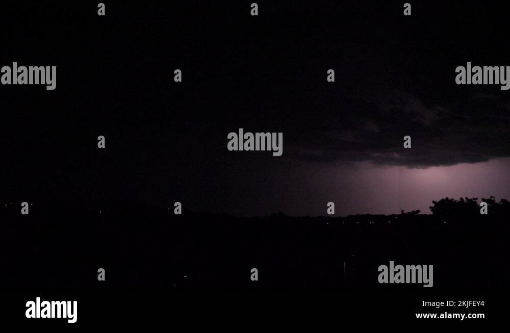 Two lightning hit different spots almost same time, slow motion Stock