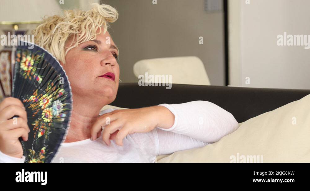 Woman menopause fan Stock Videos & Footage HD and 4K Video Clips Alamy