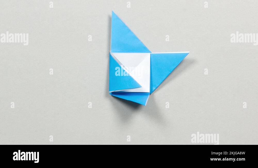 Blue and white paper folding in origami shape to reveal a message