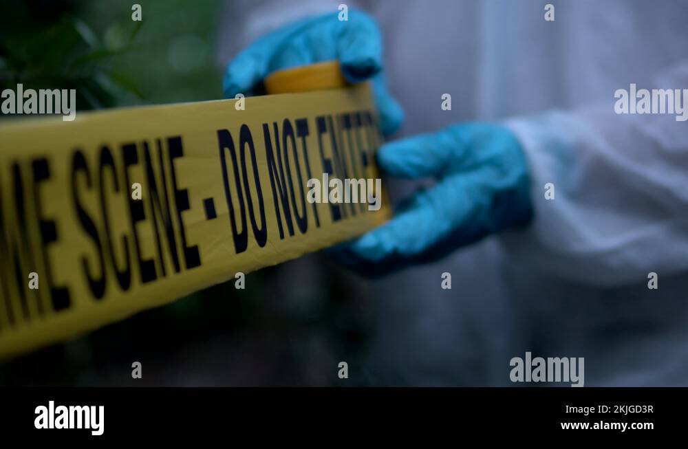 Police Put Up Crime Scene Barricade Tape In The Woods, Warning Do Not