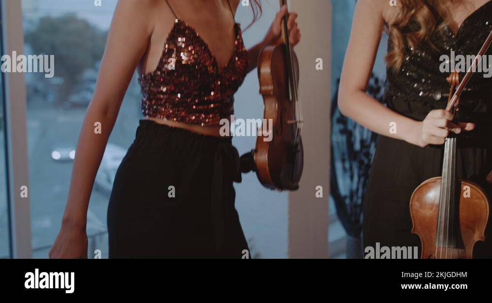 Beautiful duet of admiring women dancing and starting to play the