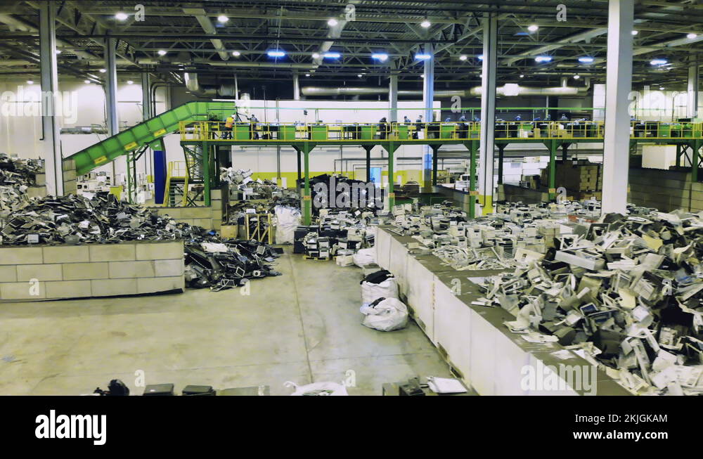 Big recycling center with piles of trash. Trash, ewaste, electronic