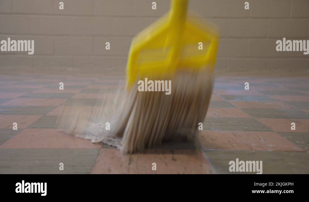 Janitor Mopping Vinyl Tile Flooring at Home or Workplace, Sanitizing