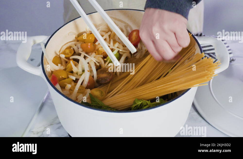 Cooking on pot pasta recipe in an enameled cast iron dutch oven Stock