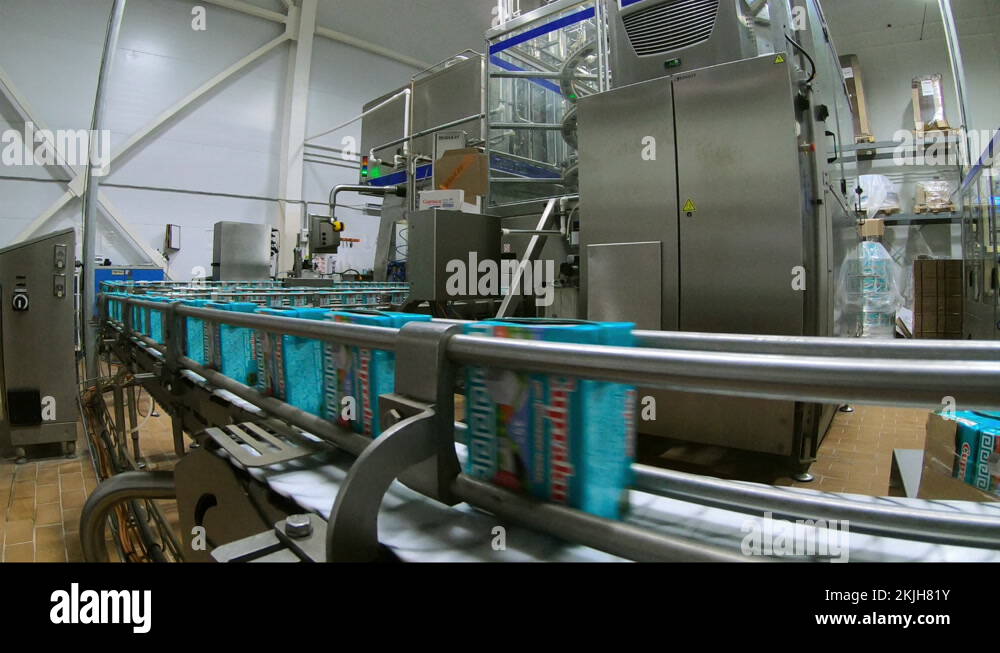 Dairy products factory. Cartons of milk. Conveyor for milk packaging