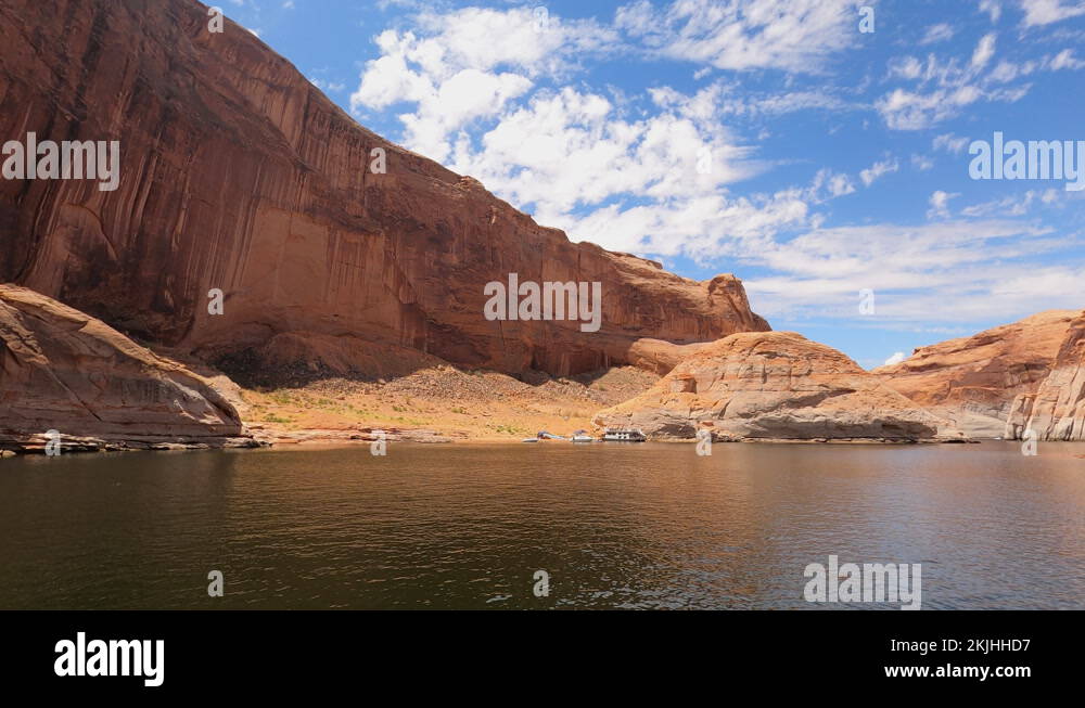 House boat family camp red rock cliff cove Lake Powell Utah 4K Stock