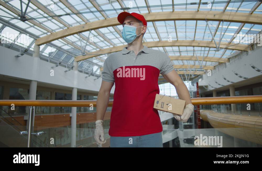 Postman delivering in gloves Stock Videos & Footage - HD and 4K Video