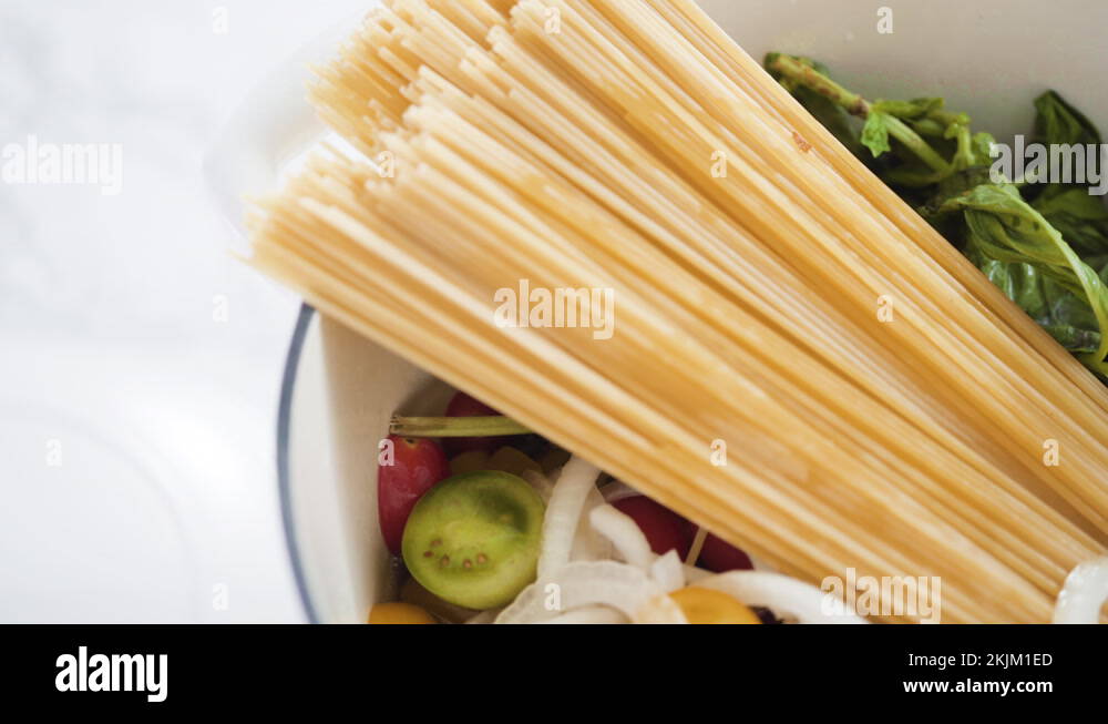 Cooking on pot pasta recipe in an enameled cast iron dutch oven Stock Video Footage Alamy