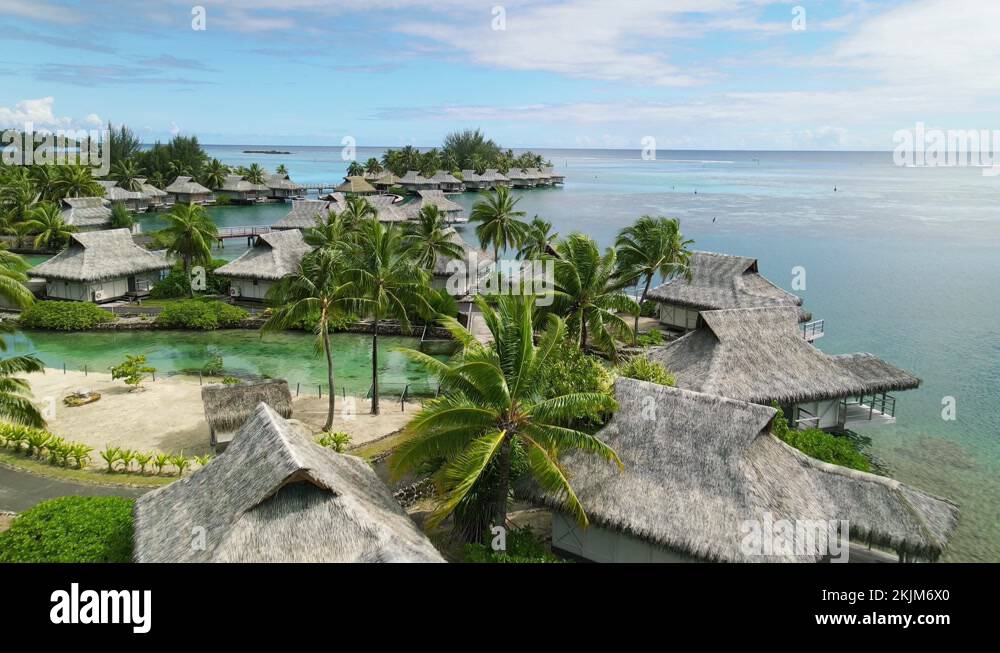 overwater bungalow villas in lagoon, Moorea, Tahiti French Polynesia
