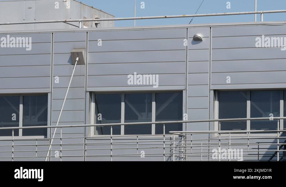 Modern office warehouse building. Doubleglazed windows on windows. Roof vents Stock Video