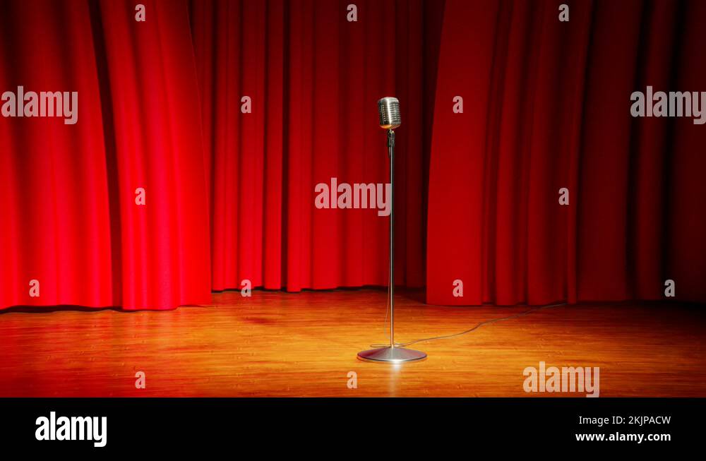 A vintage microphone on the empty stage. Old classic mic in the theatre