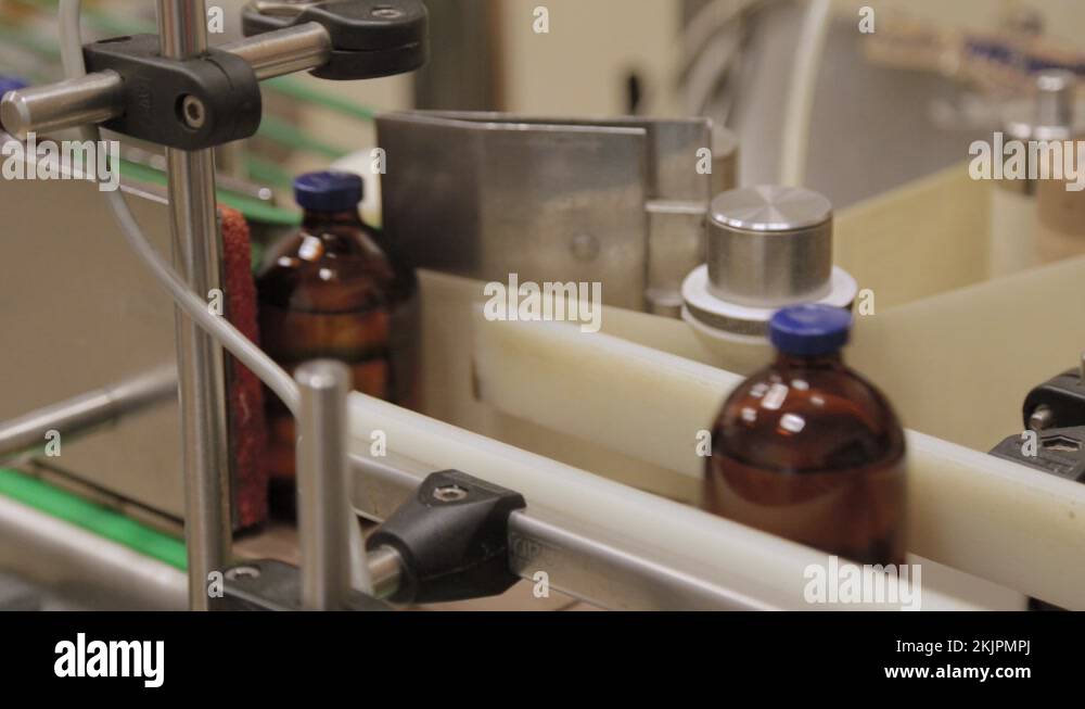 Brown medical vials are labeled. Medical vials with medicine on the