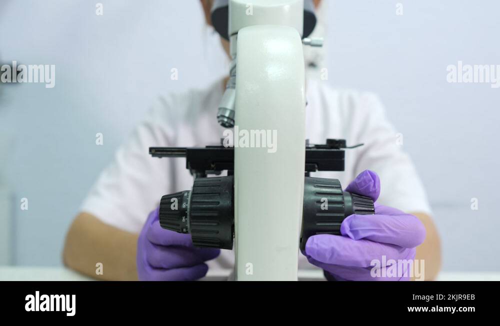 Microbiologist is testing a sample of blood contaminated by Coronavirus