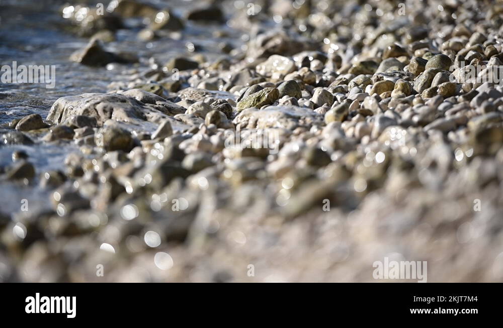 Ocean Water Washing Pebble Beach Rocks Stock Video Footage - Alamy