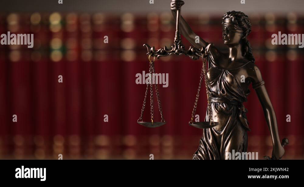 bronze blindfolded goddess representing law statue spinning, holding a