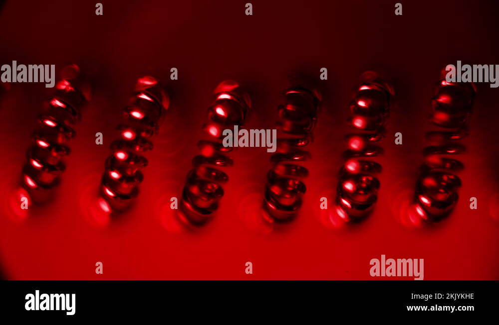 Tungsten filament under a microscope, 100 times magnification.Infrared