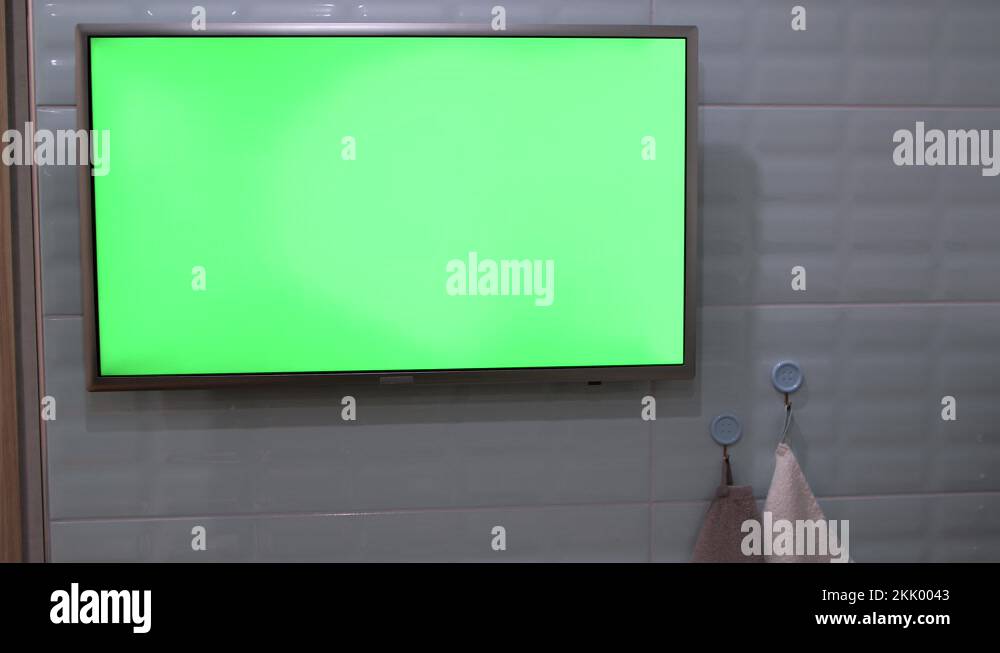 LCD TV with green screen on the wall Stock Video Footage - Alamy