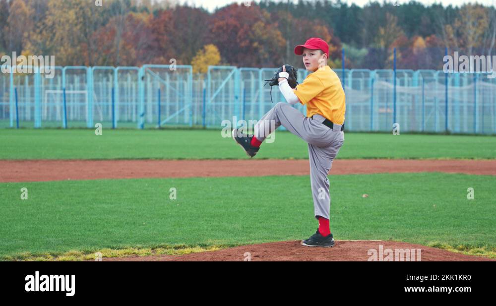 Baseball at school, the pitcher pitches fastball toward batter, boy