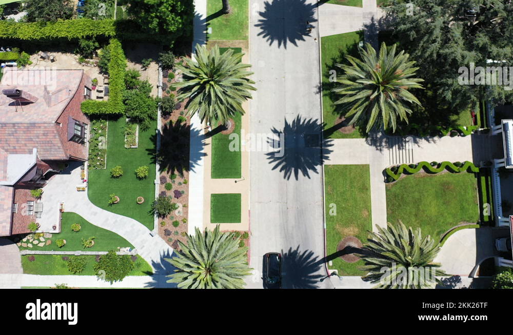 Drone zooms out while separately showing black, white, and gray cars Stock Video Footage - Alamy