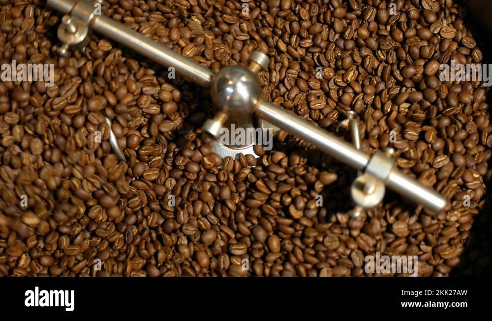 mixing coffee beans after roasting in cooling mixer, top view Stock