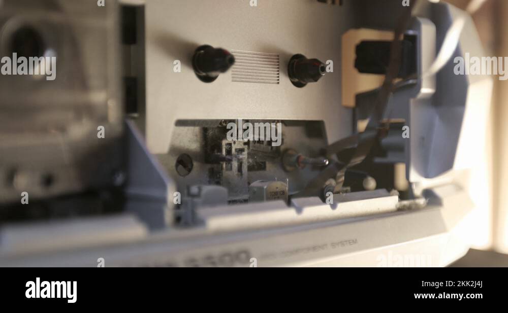 Male hands take a retro cassette tape from a tape recorder Stock Video